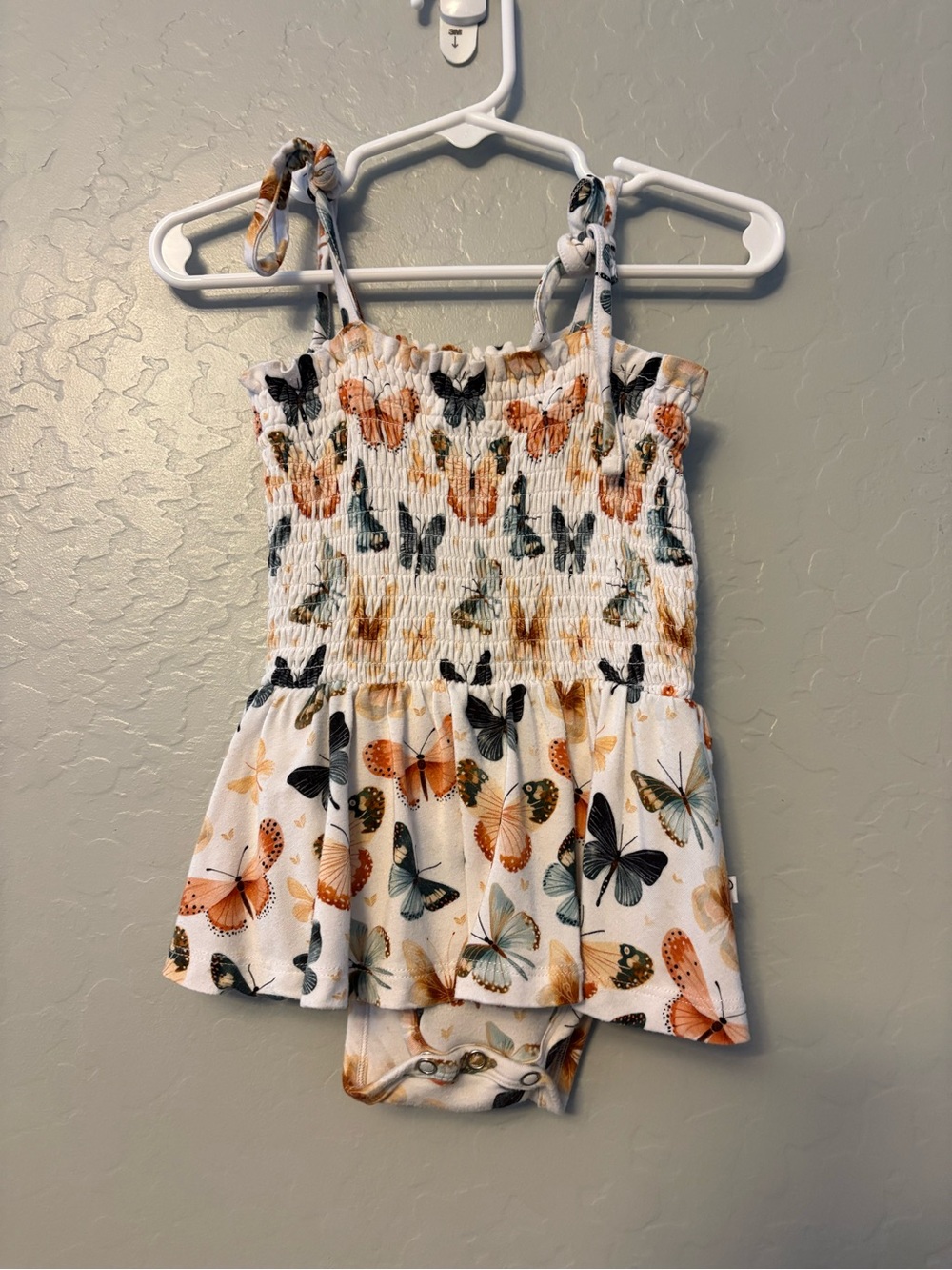 Annie Bean & co butterfly print smocked skirted tie sleeve bamboo romper 18-24